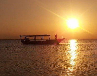 Traditional dhow sailing on crystal clear waters in Zanzibar