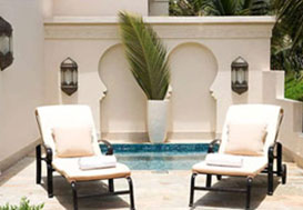 sun loungers outside a villa